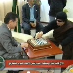 Gaddafi makes the first move (with the black pieces)